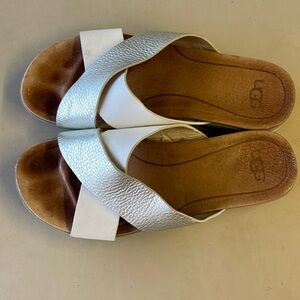 Silver and white UGG flips flops